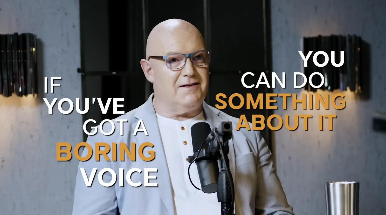 Julian Treasure at a podcast microphone on The Diary of a CEO