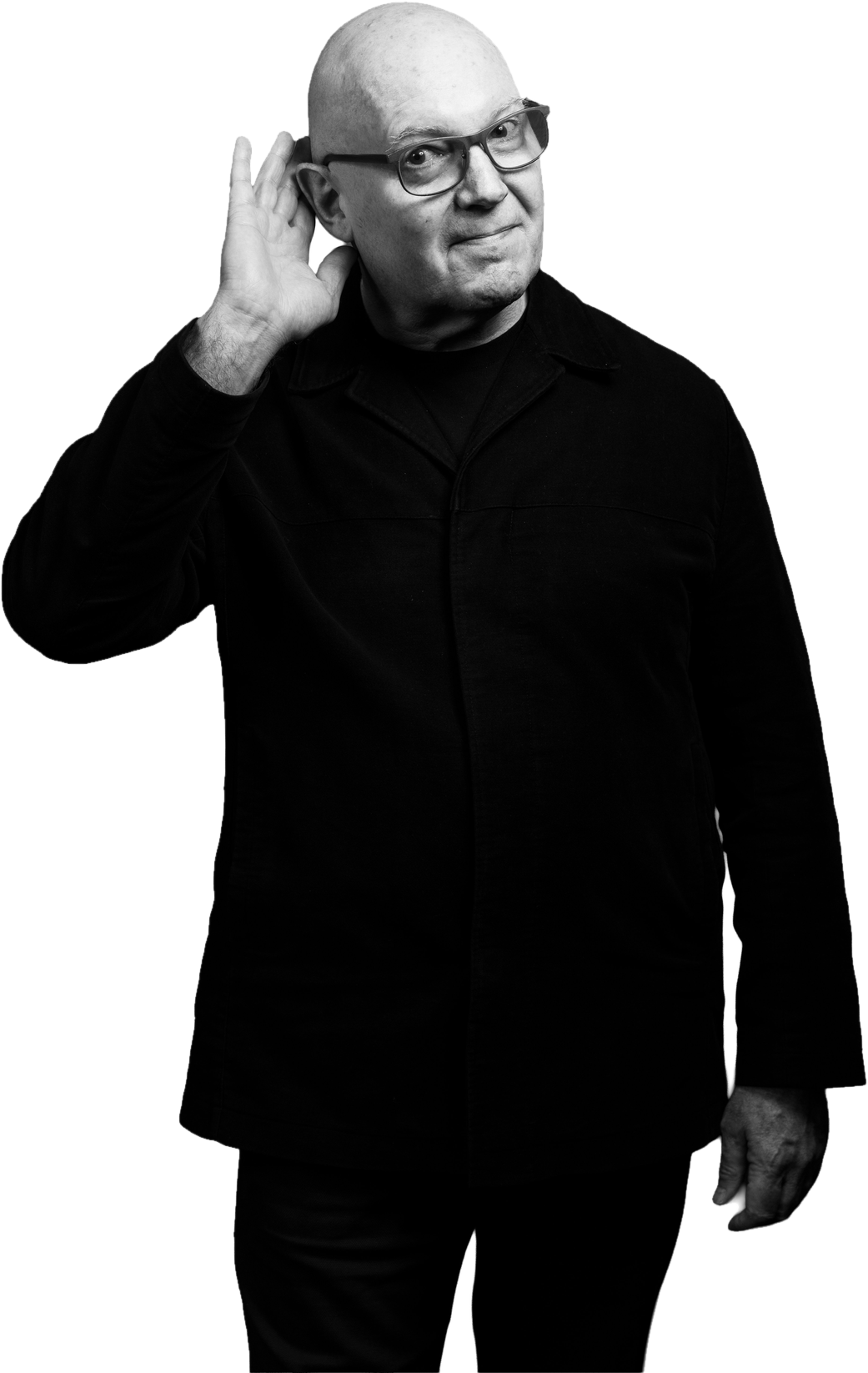 Julian Treasure in black, cupping one hand to his ear, in black and white