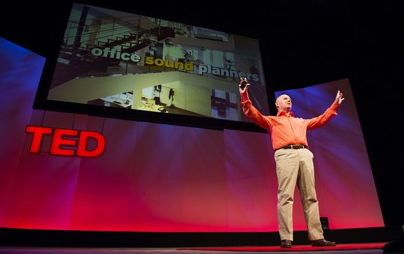 Julian Treasure with arms outstretched on a TED stage beneath a slide reading office sound planners