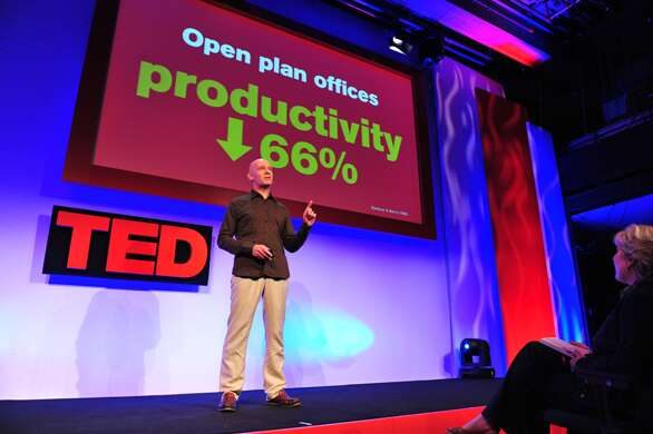 Julian Treasure on a TED stage beneath a slide reading Open plan offices, productivity down 66%